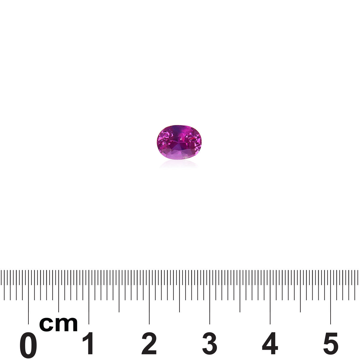 Une pierre précieuse Saphir Rose de 1,5 carat de Bonnot Paris, de petite taille et de forme ovale avec une teinte rose, est présentée au-dessus d'une règle qui mesure de 0 à 6 cm en centimètres, fournissant une échelle pour sa taille.
